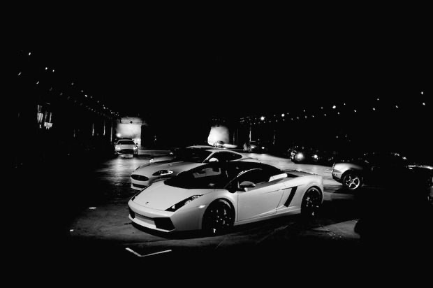 Staged fleet of exotic cars before the Opening Ceremony runway show